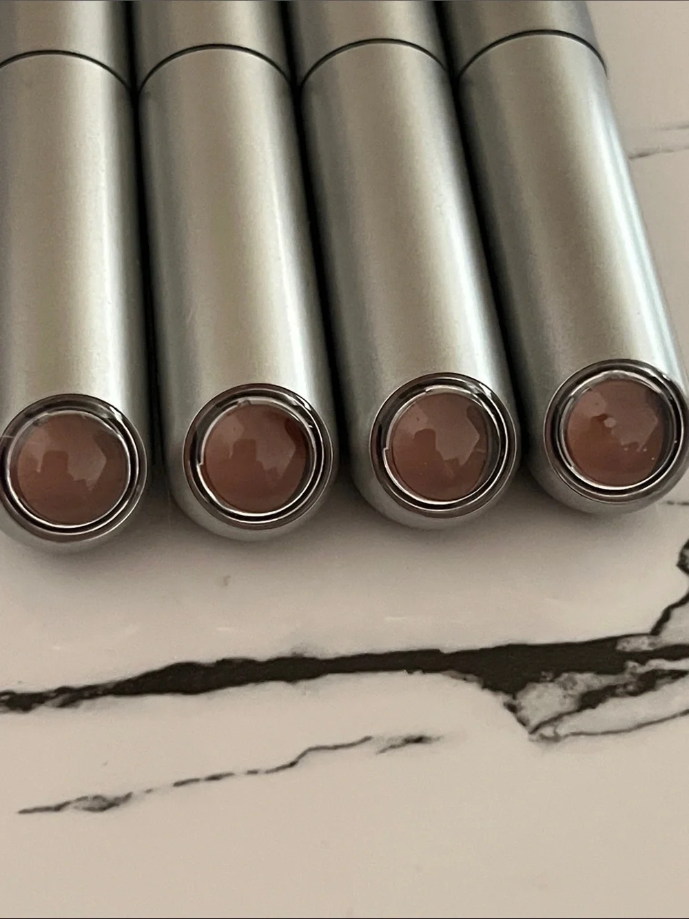 r.e.m. beauty Nude Lipstick — Sleek Silver Finish Closes with Magnet